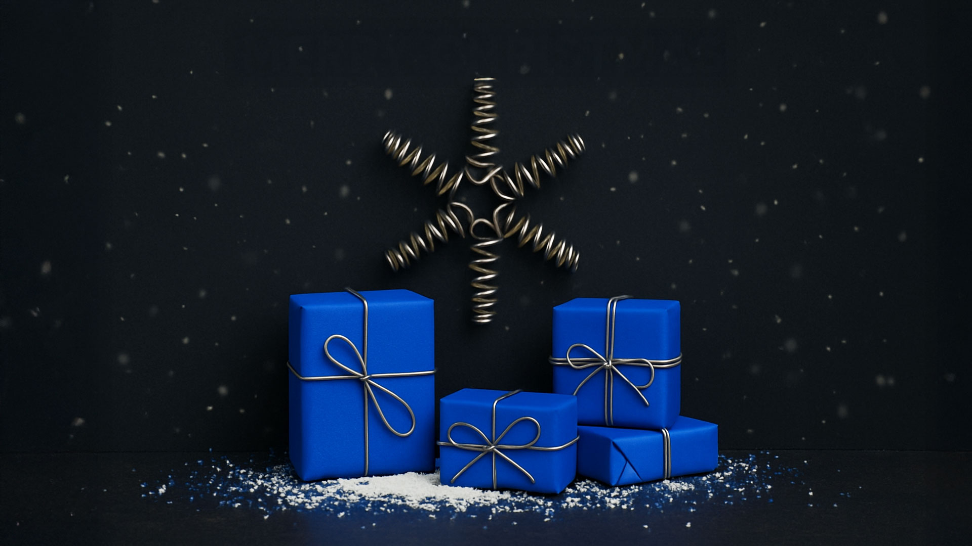 Christmas greeting from EWES featuring blue gifts and a Christmas star made of springs