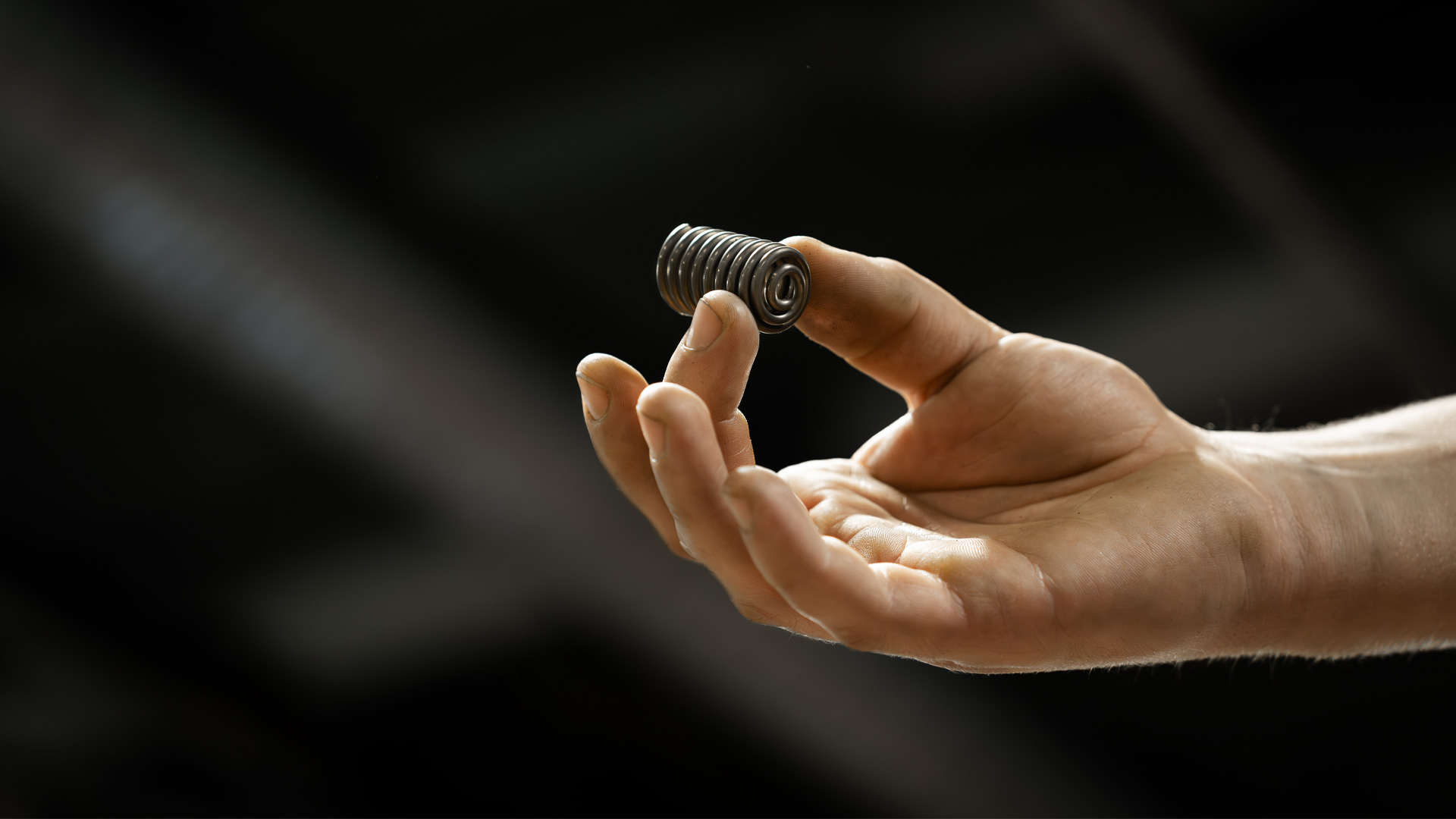 Hand holding spring